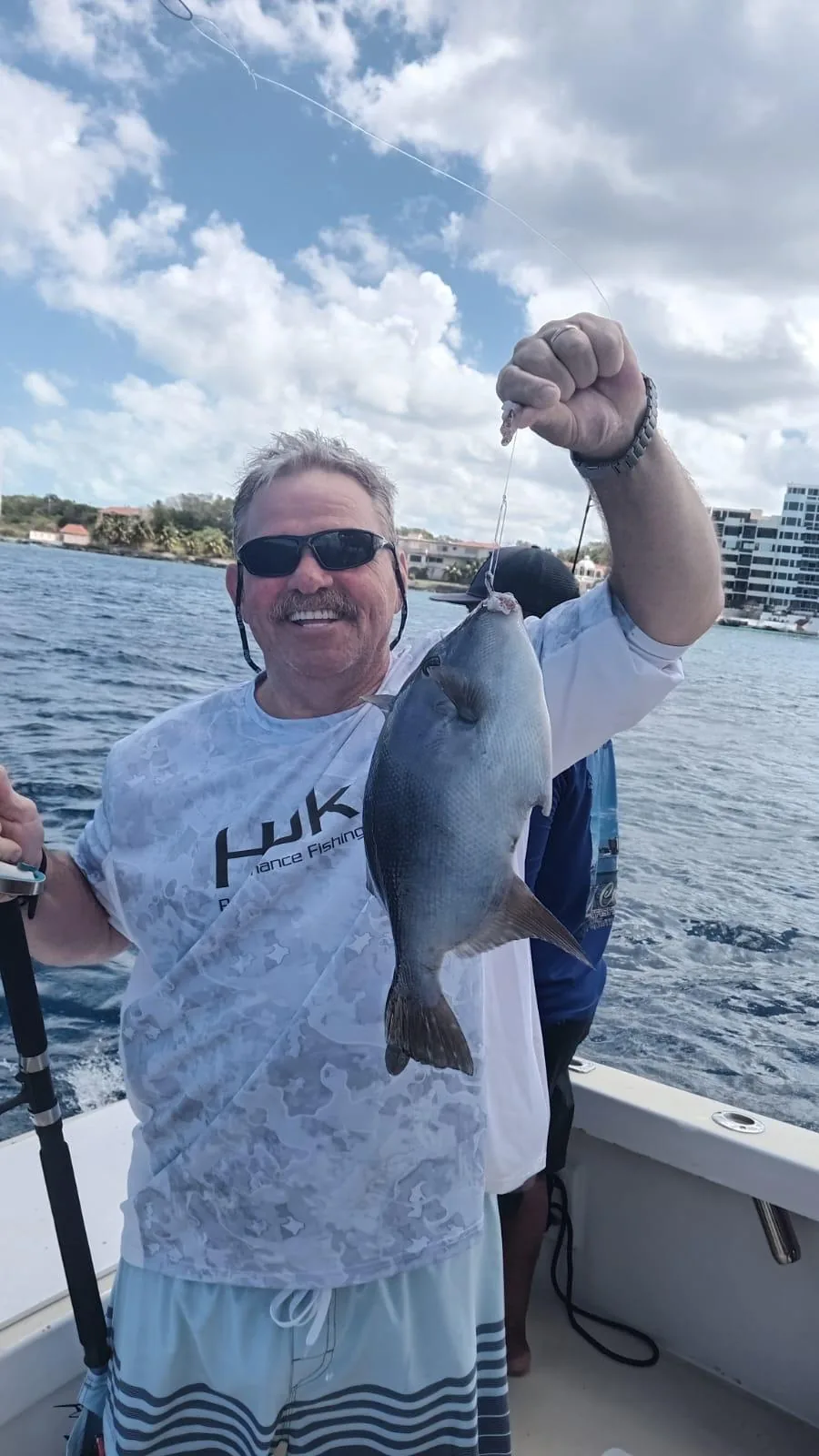 Bottom fishing at anchor with light tackle, Cozumel